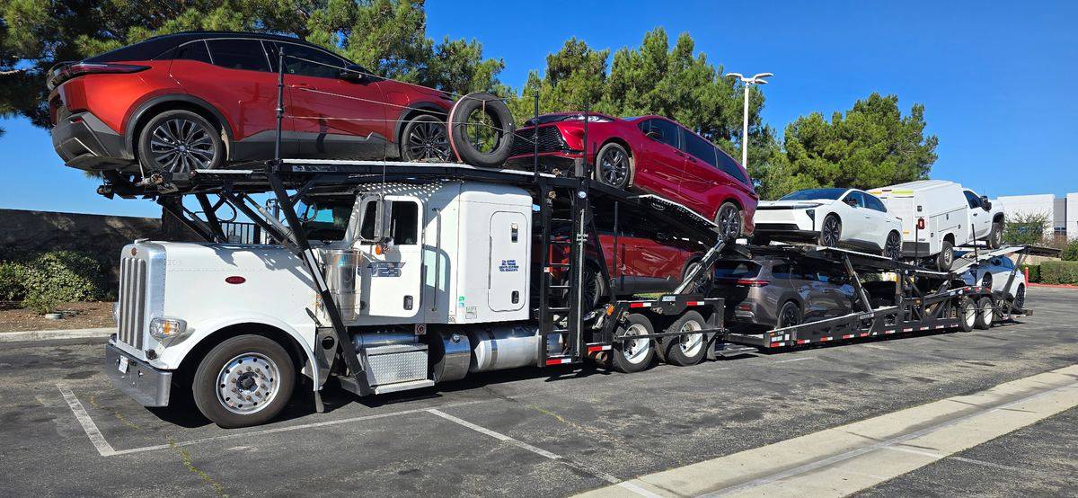 TES car hauler with a full mixed load of new vehicles