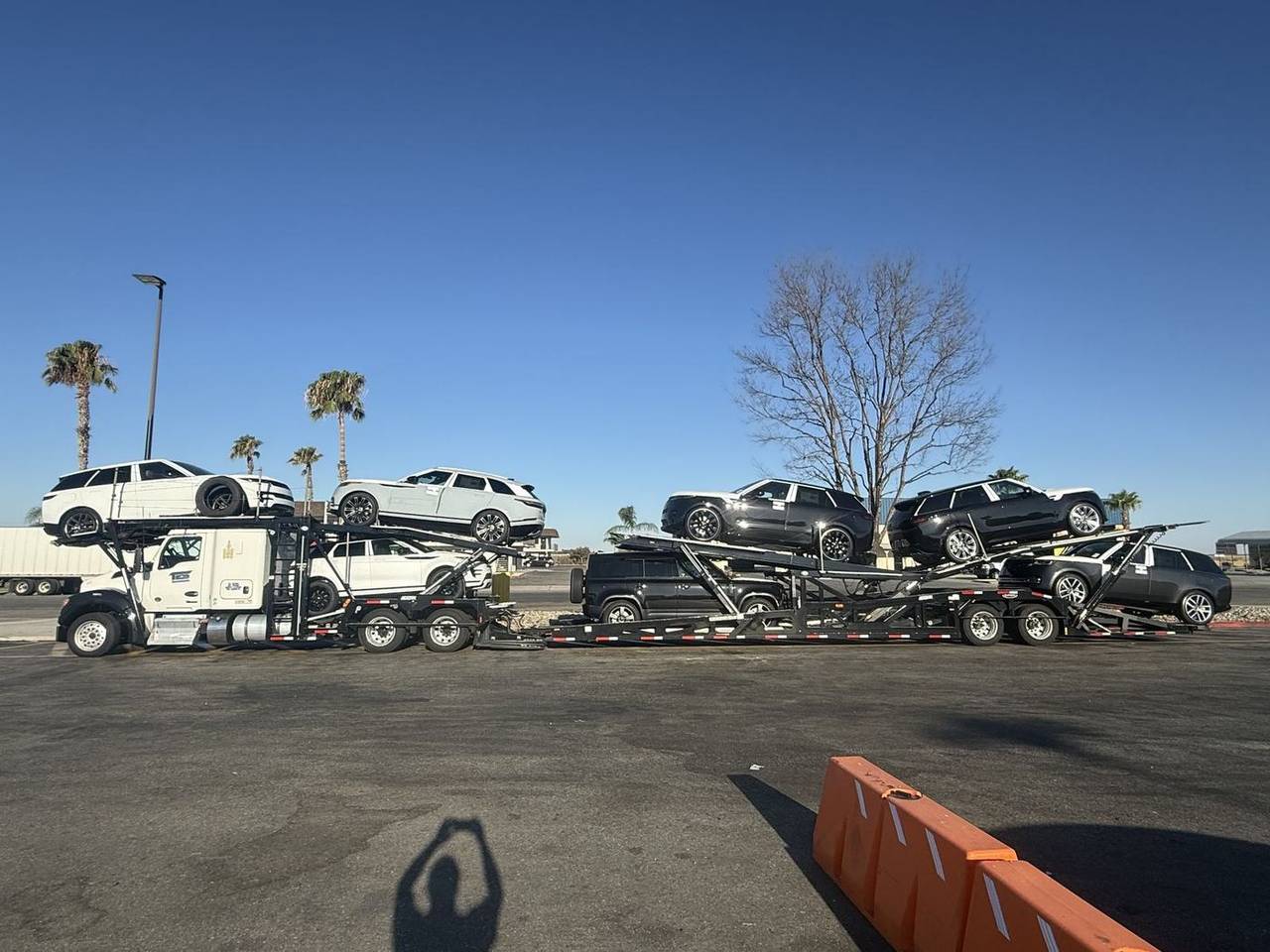 TES car hauler loaded with new luxury SUVs